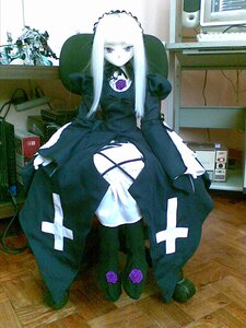 Rating: Safe Score: 0 Tags: 1girl black_dress doll dress flower frills long_hair long_sleeves purple_eyes purple_flower purple_rose rose solo standing suigintou white_hair User: admin