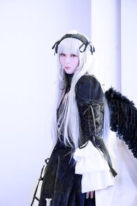 Rating: Safe Score: 0 Tags: 1girl bangs black_wings closed_mouth dress feathered_wings feathers gothic_lolita hairband long_hair long_sleeves looking_at_viewer red_eyes ribbon solo standing suigintou wings User: admin