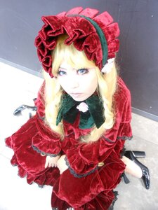 Rating: Safe Score: 0 Tags: 1girl blonde_hair blue_eyes bonnet bow dress flower frills from_above long_hair looking_at_viewer red_dress rose shinku solo User: admin