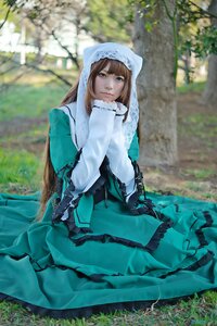 Rating: Safe Score: 0 Tags: 1girl blue_eyes blurry blurry_background brown_hair day depth_of_field dress green_dress long_hair looking_at_viewer outdoors sitting solo suiseiseki tree User: admin