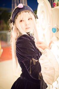 Rating: Safe Score: 0 Tags: 1girl black_dress blonde_hair blurry blurry_background depth_of_field hairband indoors lips long_sleeves looking_at_viewer solo suigintou User: admin