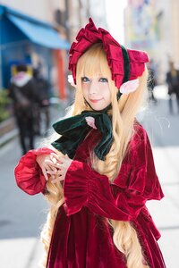 Rating: Safe Score: 0 Tags: 1girl bangs blonde_hair blue_eyes blurry blurry_background blurry_foreground bonnet depth_of_field dress long_hair looking_at_viewer photo red_dress shinku smile solo User: admin