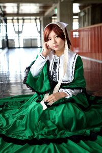 Rating: Safe Score: 0 Tags: 1girl blurry blurry_background brown_hair depth_of_field dress frills green_dress green_eyes lips long_sleeves looking_at_viewer sitting solo suiseiseki User: admin