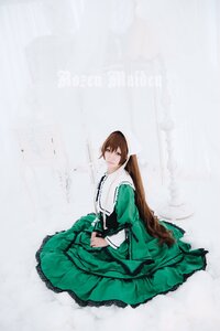 Rating: Safe Score: 0 Tags: 1girl brown_hair closed_mouth dress frills green_dress long_hair long_sleeves looking_at_viewer sitting skirt_hold solo suiseiseki very_long_hair User: admin
