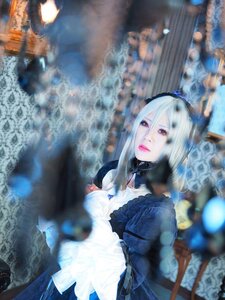 Rating: Safe Score: 0 Tags: 1girl blurry blurry_background blurry_foreground depth_of_field dress frills lips long_hair long_sleeves motion_blur photo rain red_eyes solo suigintou User: admin