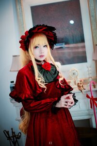 Rating: Safe Score: 0 Tags: 1girl bangs blonde_hair blue_eyes blurry blurry_background bonnet capelet dress flower lips long_hair long_sleeves looking_at_viewer photo red_dress rose shinku solo User: admin