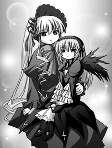 Rating: Safe Score: 0 Tags: 2girls dress frills greyscale hairband image long_hair long_sleeves looking_at_viewer monochrome multiple_girls pair ribbon shinku standing suigintou very_long_hair wings User: admin