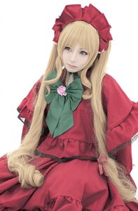 Rating: Safe Score: 0 Tags: 1girl blonde_hair blue_eyes bonnet bow bowtie dress flower lips long_hair long_sleeves looking_at_viewer red_dress rose shinku simple_background sitting solo User: admin