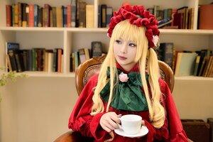 Rating: Safe Score: 0 Tags: 1girl bangs blonde_hair blue_eyes blurry blurry_background bonnet book bookshelf chair cup depth_of_field flower indoors lips long_hair long_sleeves looking_at_viewer red_dress rose saucer shinku sitting solo teacup User: admin