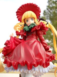 Rating: Safe Score: 0 Tags: 1girl bangs blonde_hair blue_eyes blurry bonnet bow depth_of_field doll dress frills long_hair long_sleeves looking_at_viewer pantyhose red_dress shinku solo standing twintails User: admin