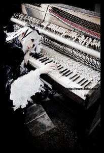Rating: Safe Score: 0 Tags: 1girl dress instrument lips monochrome playing_instrument solo suigintou User: admin