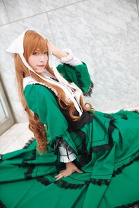 Rating: Safe Score: 0 Tags: 1girl blurry brown_hair depth_of_field dress frills green_dress heterochromia long_hair long_sleeves looking_at_viewer red_eyes smile solo suiseiseki very_long_hair User: admin