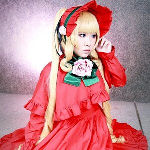 Rating: Safe Score: 0 Tags: 1girl blonde_hair blue_eyes bonnet bow bowtie dress flower green_bow long_hair long_sleeves red_dress rose shinku sitting solo User: admin