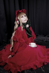Rating: Safe Score: 0 Tags: 1girl bangs blonde_hair blue_eyes bonnet bow capelet cup dress flower lips long_hair long_sleeves looking_at_viewer red_dress saucer shinku sitting solo teacup User: admin