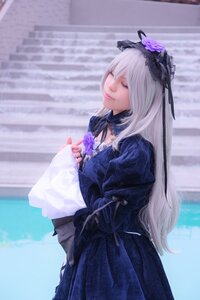 Rating: Safe Score: 0 Tags: 1girl blurry blurry_background closed_eyes closed_mouth dress flower hairband long_hair long_sleeves ribbon silver_hair solo standing suigintou very_long_hair User: admin