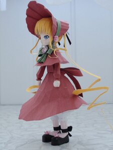 Rating: Safe Score: 0 Tags: 1girl black_footwear blonde_hair blue_eyes bonnet bow bowtie doll dress flower full_body green_bow long_hair long_sleeves looking_at_viewer looking_back photo red_dress shinku shoes sidelocks solo standing User: admin