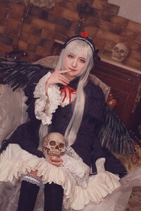 Rating: Safe Score: 0 Tags: 1girl black_legwear dress feathers frills gothic_lolita hairband lolita_fashion long_hair long_sleeves looking_at_viewer red_eyes ribbon sitting solo suigintou thighhighs wings User: admin