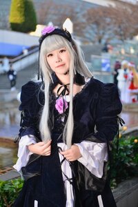 Rating: Safe Score: 0 Tags: 1girl black_dress blurry blurry_background blurry_foreground brown_eyes depth_of_field dress flower gothic_lolita hairband lips long_hair long_sleeves looking_at_viewer outdoors photo ribbon solo solo_focus standing suigintou User: admin