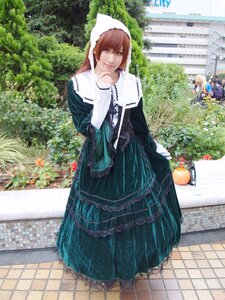 Rating: Safe Score: 0 Tags: brown_hair chain-link_fence dress fence flower green_dress long_hair long_sleeves looking_at_viewer multiple_girls outdoors pavement smile solo standing suiseiseki tile_floor tiles tree User: admin
