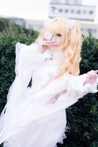 Rating: Safe Score: 0 Tags: 1girl blonde_hair blurry blurry_background day depth_of_field dress kirakishou lips long_hair long_sleeves looking_at_viewer outdoors photo solo striped white_dress User: admin