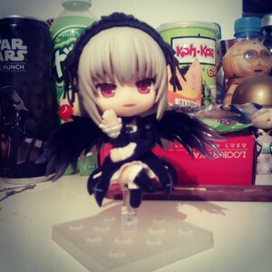 Rating: Safe Score: 0 Tags: 1girl chibi doll dress long_hair photo red_eyes sitting solo suigintou thighhighs white_hair wings User: admin