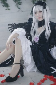 Rating: Safe Score: 0 Tags: 1girl bangs black_footwear closed_mouth dress flower high_heels lips long_hair looking_at_viewer ribbon sitting solo suigintou white_hair User: admin