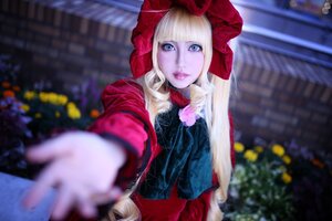 Rating: Safe Score: 0 Tags: 1girl bangs blonde_hair blue_eyes blurry blurry_background blurry_foreground depth_of_field doll_joints dress flower foreshortening giving hood lips looking_at_viewer outdoors outstretched_arm reaching_out red_dress rose shinku solo User: admin