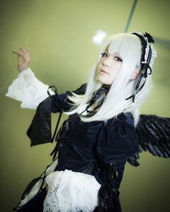 Rating: Safe Score: 0 Tags: 1girl black_wings doll_joints dress feathered_wings feathers gothic_lolita hairband joints long_hair long_sleeves red_eyes solo suigintou white_hair wings User: admin