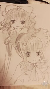 Rating: Safe Score: 0 Tags: 2girls bow hair_bow hat hinaichigo image looking_at_viewer monochrome multiple_girls pair shinku sketch smile traditional_media User: admin