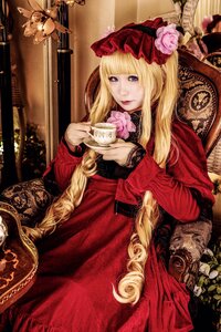 Rating: Safe Score: 0 Tags: 1girl blonde_hair blue_eyes bonnet cup dress flower food holding holding_cup lace long_hair looking_at_viewer red_dress rose shinku sitting solo teacup User: admin