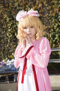 Rating: Safe Score: 0 Tags: 1girl bangs blonde_hair blurry blurry_background curly_hair depth_of_field dress frills green_eyes hinaichigo lips long_sleeves looking_at_viewer outdoors photo pink_dress realistic solo standing User: admin