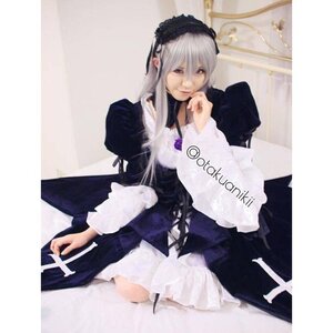 Rating: Safe Score: 0 Tags: 1girl bangs dress flower frills hairband long_hair long_sleeves looking_at_viewer silver_hair sitting solo suigintou User: admin