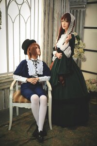 Rating: Safe Score: 0 Tags: 2girls blue_dress brown_hair dress flower hat long_hair long_sleeves maid multiple_cosplay multiple_girls sitting tagme User: admin