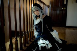 Rating: Safe Score: 0 Tags: 1girl dress frills hairband long_hair long_sleeves looking_at_viewer silver_hair sitting solo standing suigintou User: admin