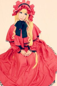 Rating: Safe Score: 0 Tags: 1girl blonde_hair blue_eyes bow capelet dress long_hair long_sleeves looking_at_viewer red_dress shinku sitting solo User: admin