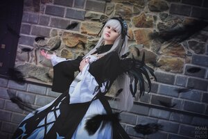 Rating: Safe Score: 0 Tags: 1girl bangs blunt_bangs dress feathers holding long_hair long_sleeves looking_at_viewer solo standing suigintou wide_sleeves User: admin