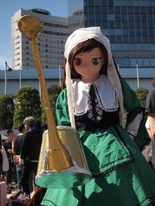 Rating: Safe Score: 0 Tags: 1girl brown_hair building dress green_eyes head_scarf heterochromia long_sleeves looking_at_viewer outdoors sitting solo suiseiseki User: admin