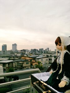 Rating: Safe Score: 0 Tags: 1girl black_dress brown_hair building city cityscape doll dress green_eyes long_sleeves outdoors railing sky skyscraper solo standing suiseiseki User: admin