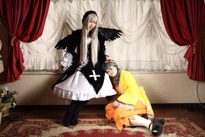 Rating: Safe Score: 0 Tags: 2girls angel_wings black_wings closed_eyes curtains dress hat long_hair multiple_cosplay multiple_girls silver_hair sitting suigintou tagme wings User: admin