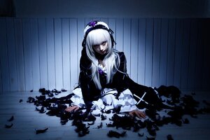 Rating: Safe Score: 0 Tags: 1girl black_dress dress feathers flower frills hairband long_hair long_sleeves silver_hair sitting solo suigintou User: admin