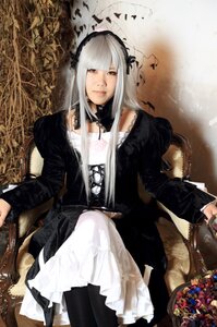 Rating: Safe Score: 0 Tags: 1girl bangs dress feathers flower hairband lolita_fashion long_hair long_sleeves looking_at_viewer red_eyes sitting solo suigintou User: admin