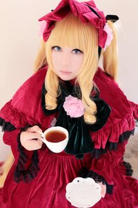 Rating: Safe Score: 0 Tags: 1girl bangs blonde_hair blue_eyes bow cup dress frills holding holding_cup lolita_fashion long_hair looking_at_viewer red_dress shinku solo tea teacup User: admin