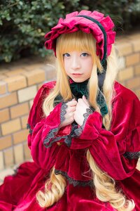 Rating: Safe Score: 0 Tags: 1girl bangs blonde_hair blue_eyes blurry blurry_background bonnet depth_of_field dress hands_together lace lips long_hair long_sleeves looking_at_viewer outdoors red_dress shinku sitting solo User: admin