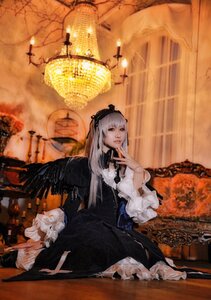 Rating: Safe Score: 0 Tags: 1girl black_wings dress flower frills hairband long_hair long_sleeves looking_at_viewer silver_hair sitting solo suigintou wings User: admin