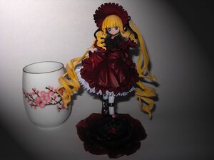 Rating: Safe Score: 0 Tags: 1girl auto_tagged blonde_hair bow cup doll dress drill_hair flower hat long_hair long_sleeves red_dress rose shinku solo teacup twintails very_long_hair User: admin