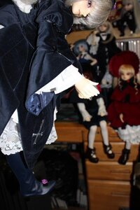 Rating: Safe Score: 0 Tags: blonde_hair blurry blurry_background blurry_foreground depth_of_field doll dress figure hat long_sleeves multiple_dolls multiple_girls photo short_hair sitting standing tagme User: admin