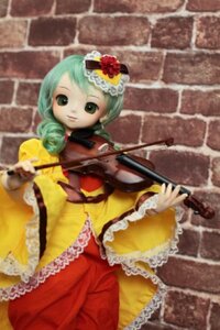 Rating: Safe Score: 0 Tags: 1girl blurry brick_wall depth_of_field doll dress drill_hair frills green_hair hat kanaria long_sleeves looking_at_viewer solo standing wall wide_sleeves User: admin