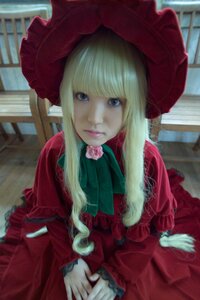 Rating: Safe Score: 0 Tags: 1girl bangs blonde_hair blue_eyes blurry bonnet bow depth_of_field dress flower frills hat indoors lips long_hair long_sleeves looking_at_viewer red_dress red_headwear rose shinku sidelocks sitting solo User: admin