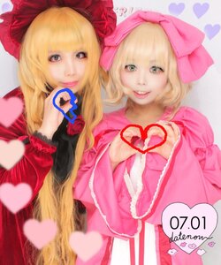 Rating: Safe Score: 0 Tags: 2girls blonde_hair blurry bow depth_of_field dress heart heart_hands long_hair looking_at_viewer multiple_cosplay multiple_girls photo short_hair smile tagme User: admin