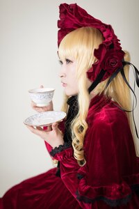 Rating: Safe Score: 0 Tags: 1girl blonde_hair blue_eyes bonnet bow cup dress flower holding holding_cup lips long_hair profile realistic red_dress ribbon rose saucer shinku solo tea teacup User: admin